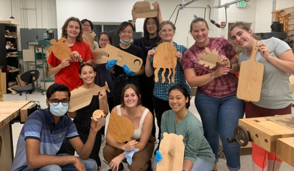 Students posing with their competed cutting boards after the workshop!